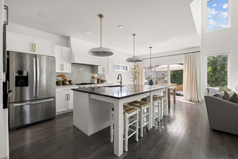 Kitchen island open to the living room and staircase