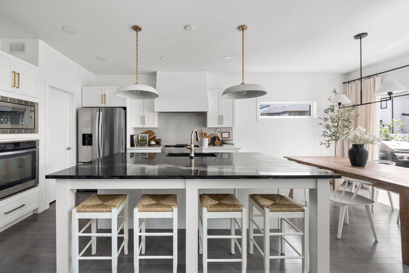 Kitchen with waterfall island and a wall of built-in cabinetry