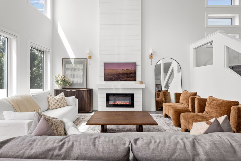 Living room seating open to the kitchen island