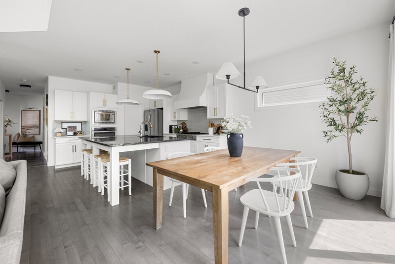 Dining area with a modern chandelier and patio doors