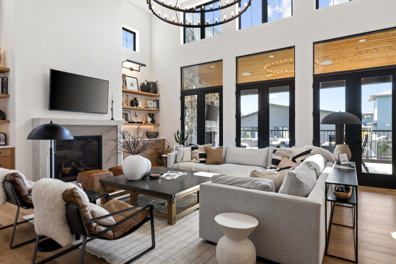 Living room with sectional sofa, fireplace and chandelier