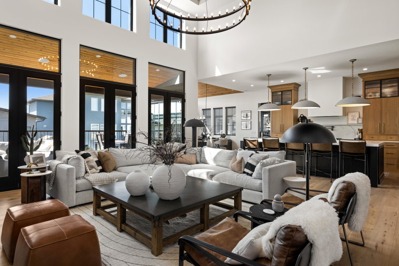Living room with a view through to the kitchen and loft staircase