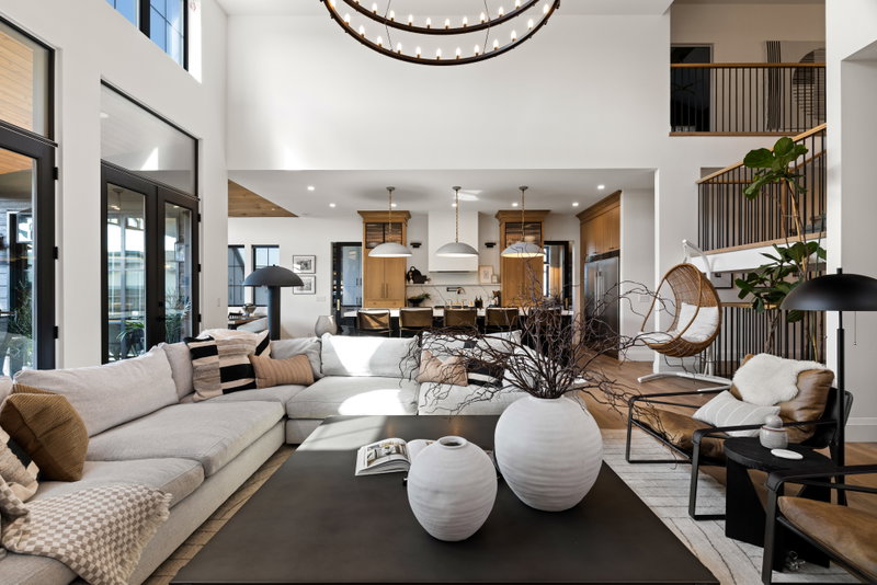 Living room with a gallery wall and hanging rattan chair