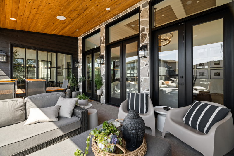 Covered deck with lounge seating off the main living area