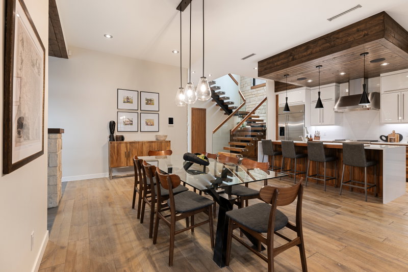 Dining area with wraparound windows overlooking the yard
