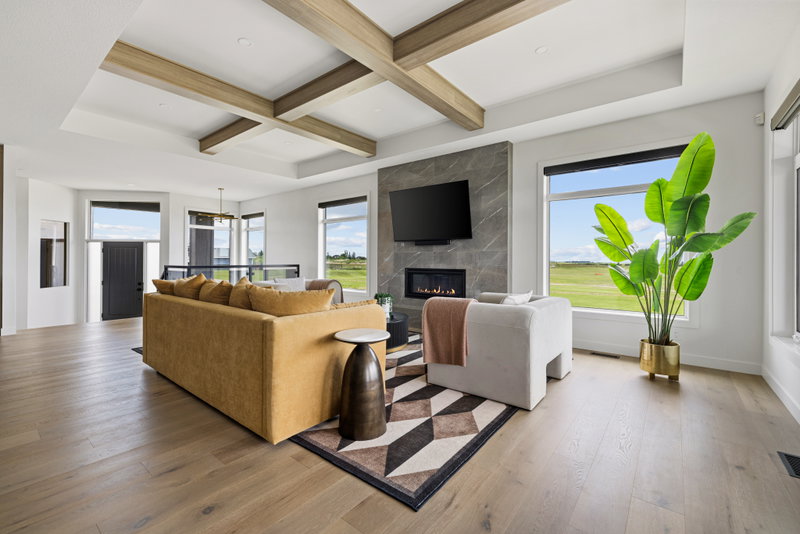 Upstairs bonus room with a stone fireplace overlooking the golf course