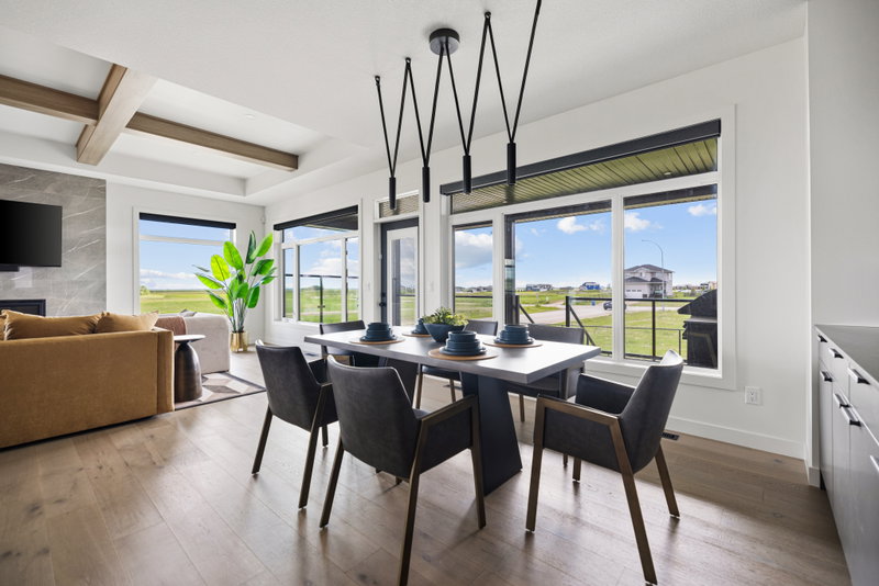 Dining area with built-in banquette and wall-mounted television