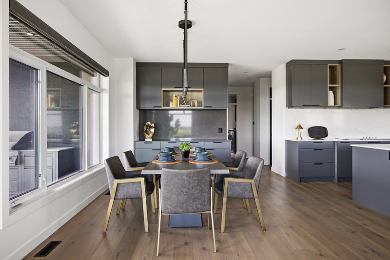 Dining table open to the kitchen, with views over the golf course