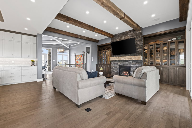 Great room seating with sliding doors to the sunroom
