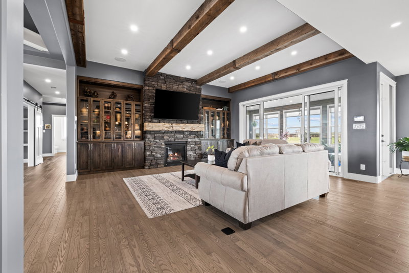 Living room with built-in display cabinetry flanking the fireplace