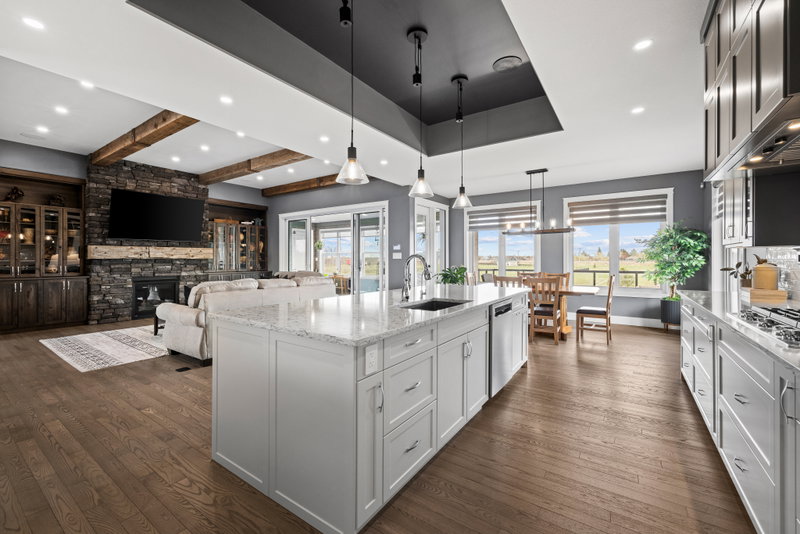 Kitchen island with seating and a view to the great room