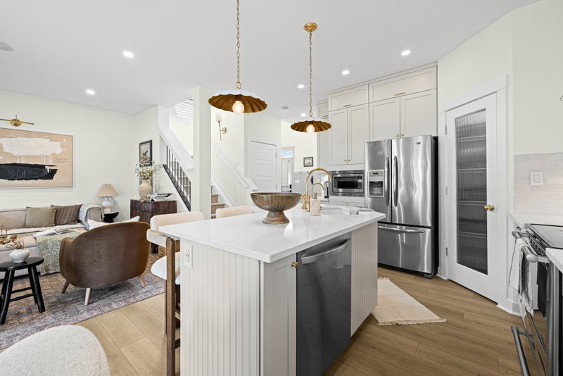 Kitchen island with pendant lighting, open to the living room