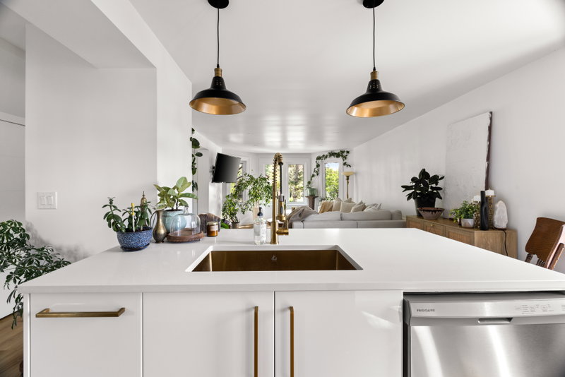 Kitchen island viewed toward the living area and windows