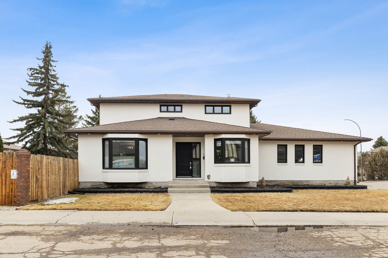 Home exterior with attached garage and landscaped front yard