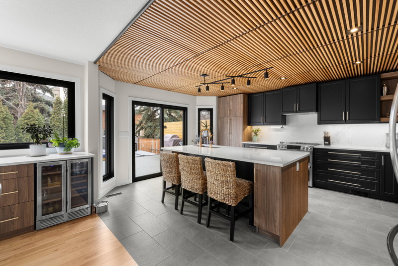 Breakfast nook with a built-in wine fridge and sliding doors to the patio