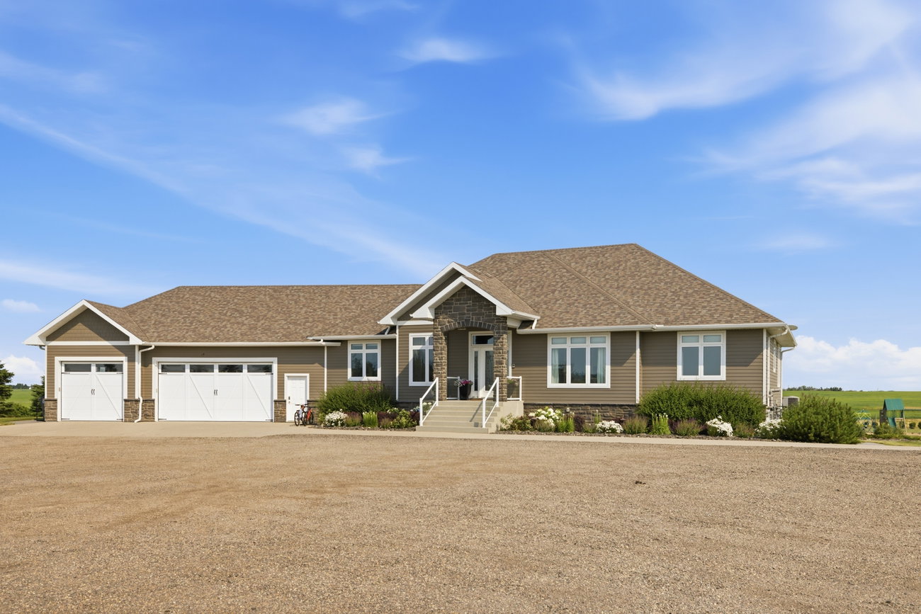 Craftsman-style bungalow exterior with stone accents and a covered entry