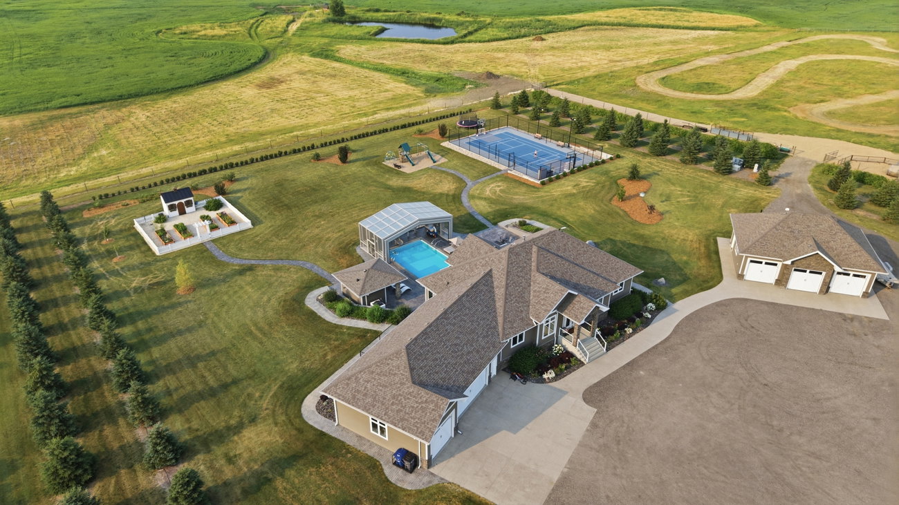 Aerial photograph of the acreage showing the pool, sport court, garden and detached garage