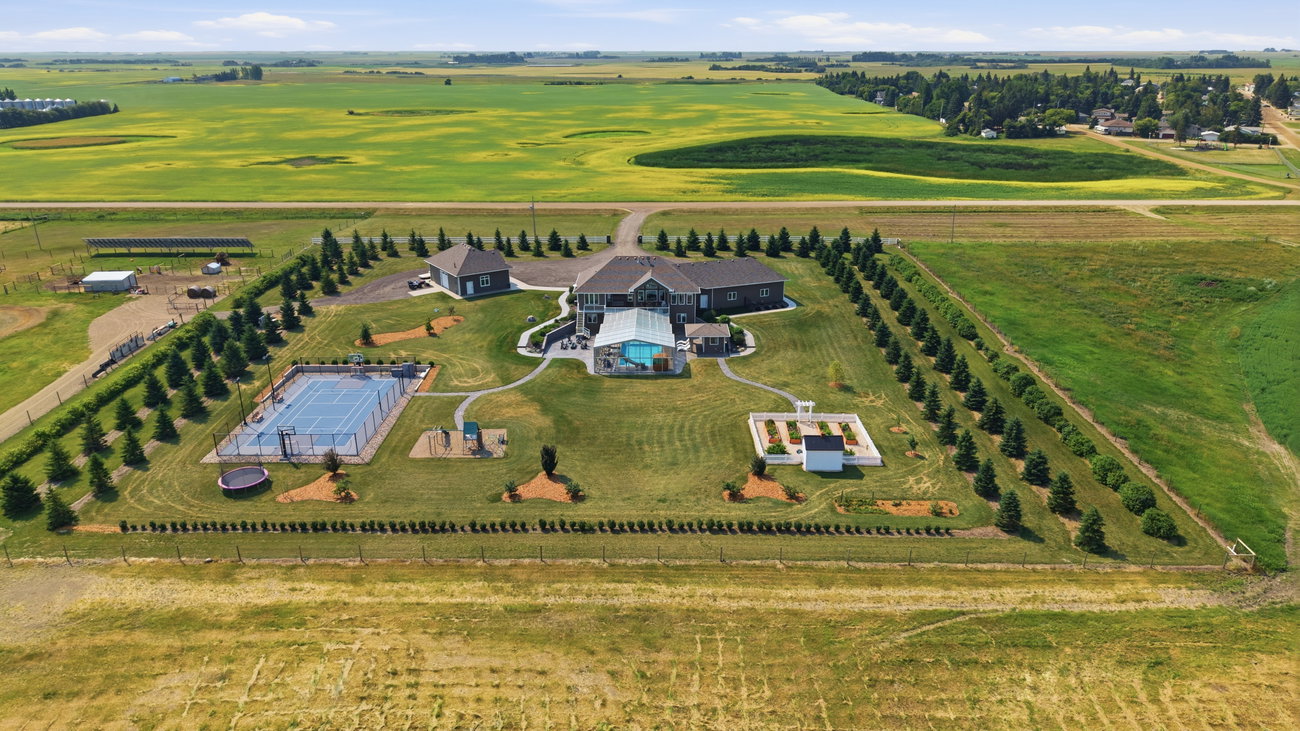 Aerial photograph of the backyard, pool and sport court from above