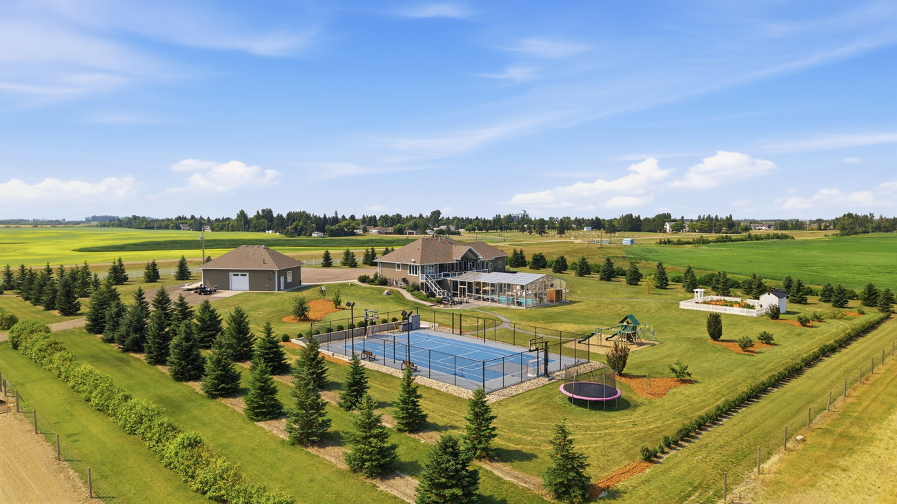 Aerial photograph of the acreage property set among open fields