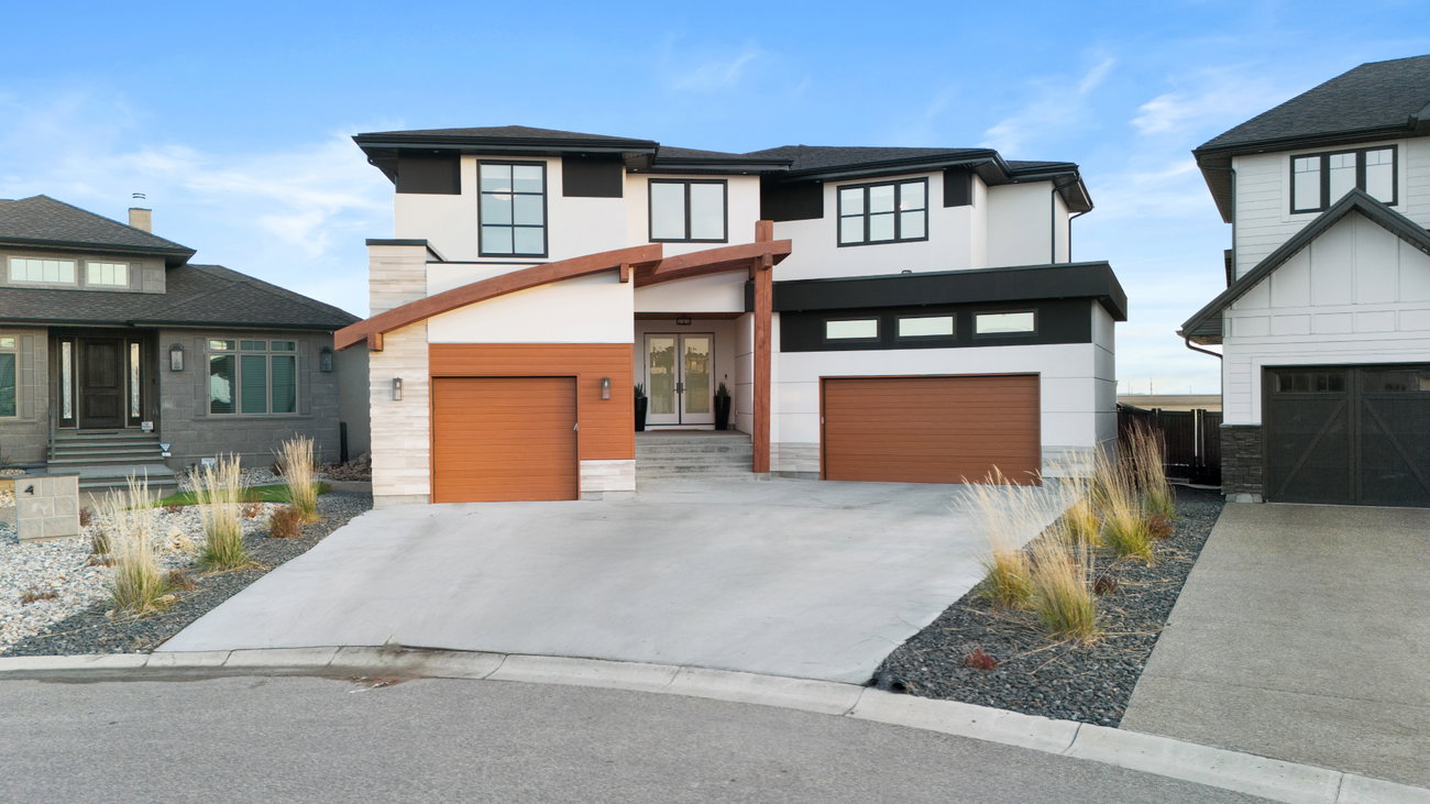 Two-storey home exterior with a double garage and covered entry