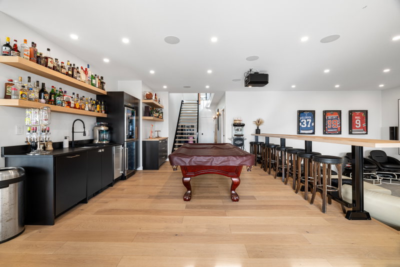 Finished basement family room with recessed lighting